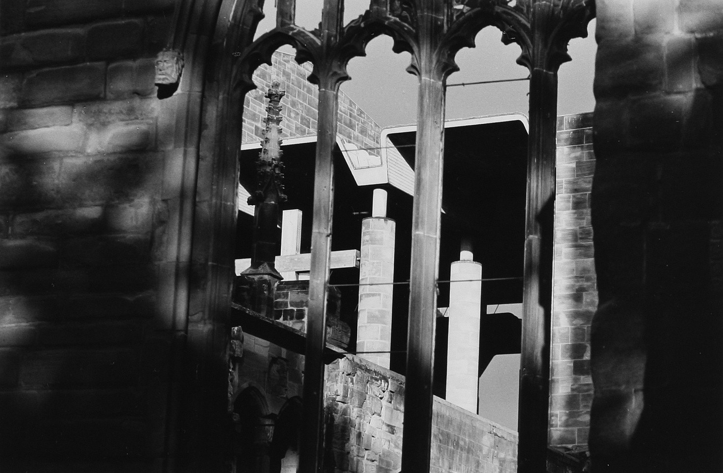 Figure 7. The new Coventry Cathedral, by Basil Spence, seen through the remains of the old Cathedral. 1991 ©Deutsche Fotothek / Borchert, Christian