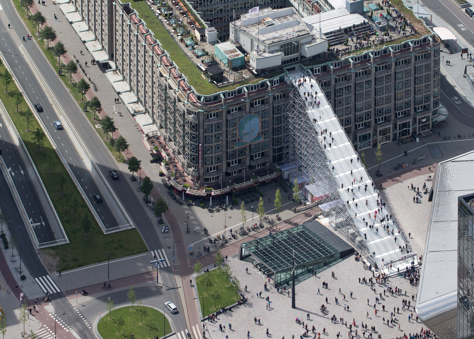 Figure 5. Rotterdam, Netherlands, The Stairs, leading up to the roof of an office block in city centre. Artwork in the public domain, https://www.dezeen.com